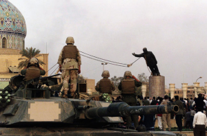Toppling the statue of Saddam Hussein was a staged event, by U.S. soldiers, for the media. A Reuters long-shot of Firdos Square where the statue was located (see below) shows that the Square was nearly empty when Saddam was torn down. The Square was sealed off by the U.S. military. The 200 people milling about were U.S. Marines, international press and Iraqis. However, the media portrayed it as an event of the Iraqi people.